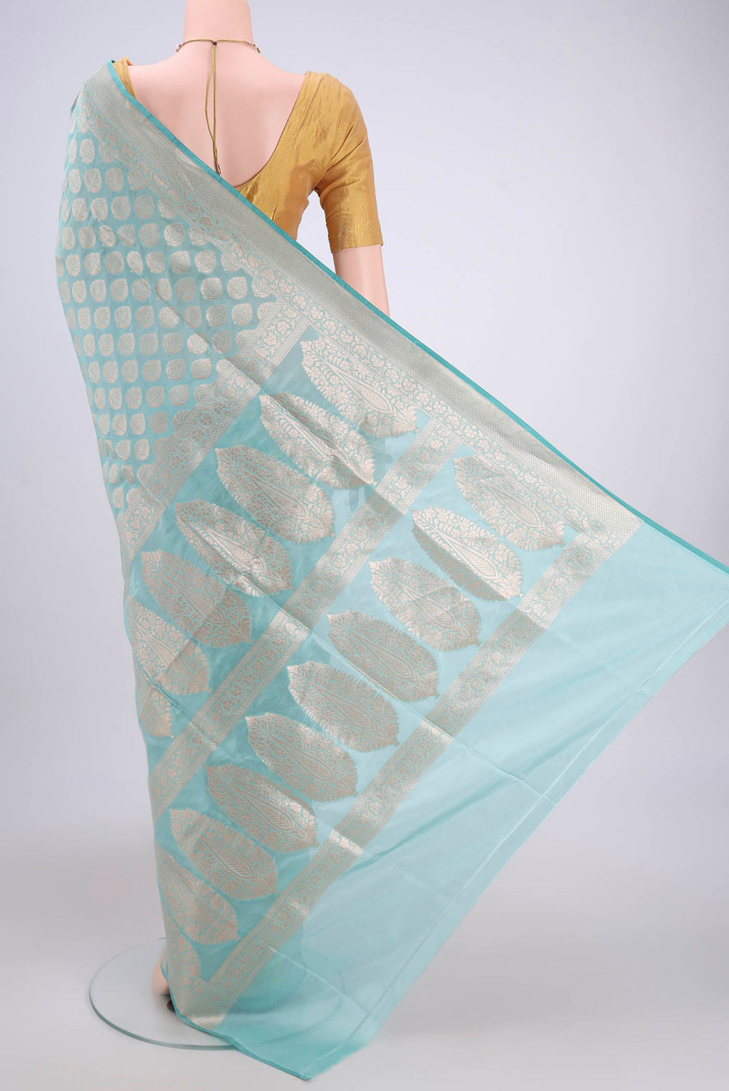 Flat view of Sea Green Dual Tone Banarasi Silk Saree with Zari Butta on the body and Zari Border. 