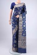 Blue Banarasi Tussar Silk Saree with Zari And Thread Butta on the body and Zari And Thread Border.  displayed on a mannequin