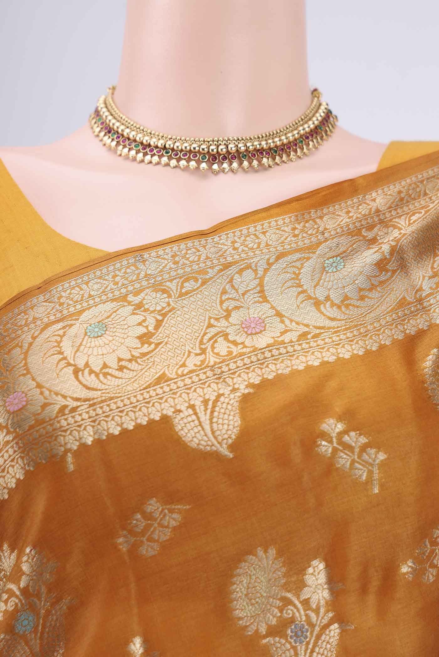 Border image of Mustard Banarasi Tussar Silk Saree with Zari Butta on the body and Zari Border. 