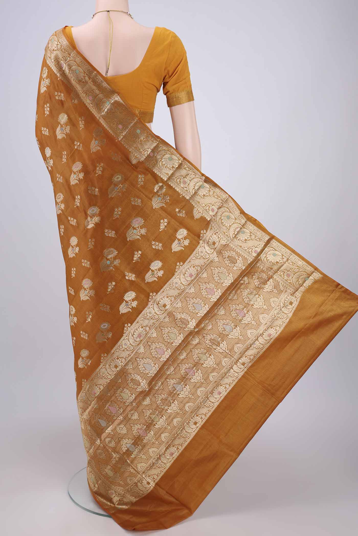 Flat view of Mustard Banarasi Tussar Silk Saree with Zari Butta on the body and Zari Border. 