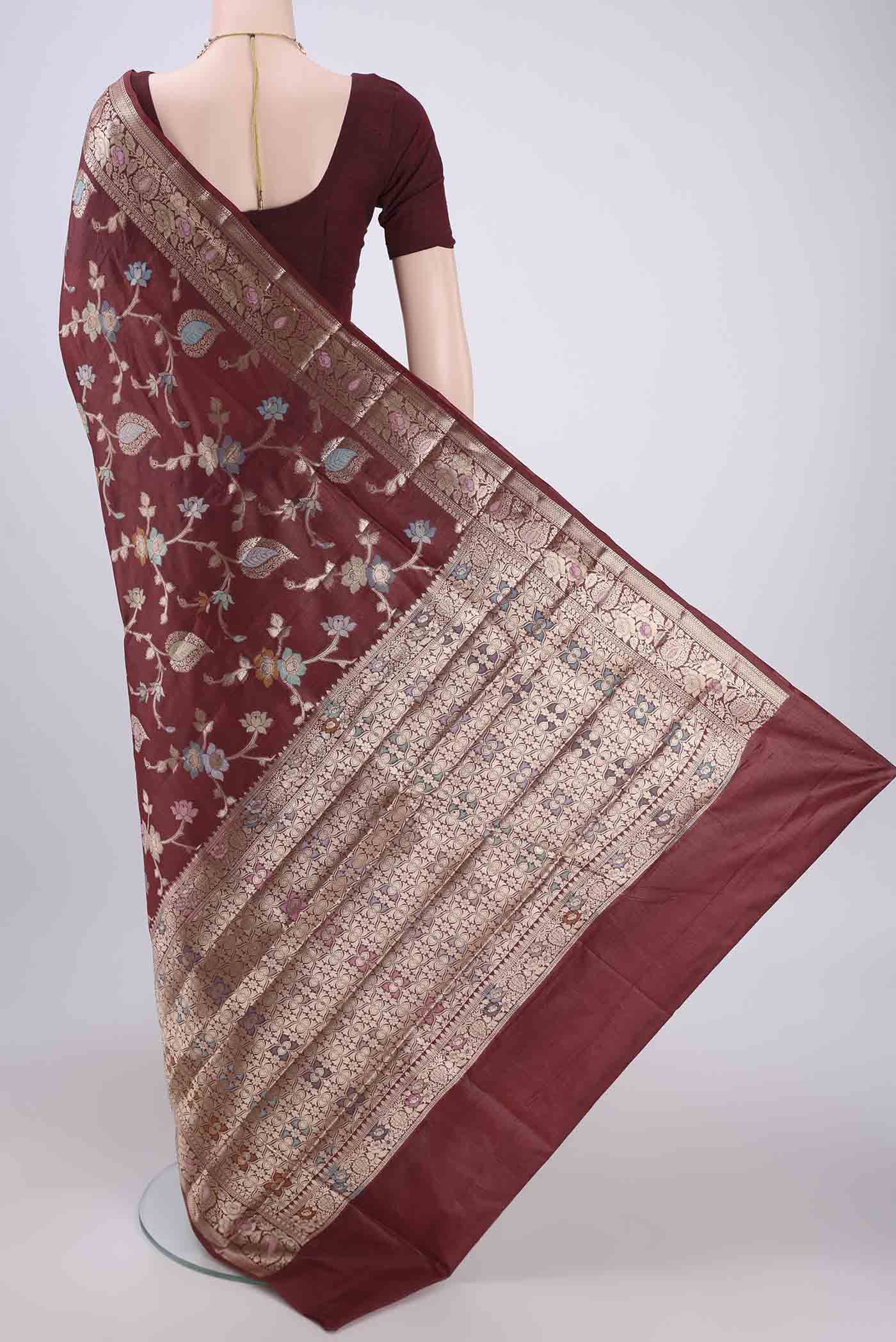 Flat view of Brown Banarasi Tussar Silk Saree with Zari And Thread Butta on the body and Zari And Thread Border. 