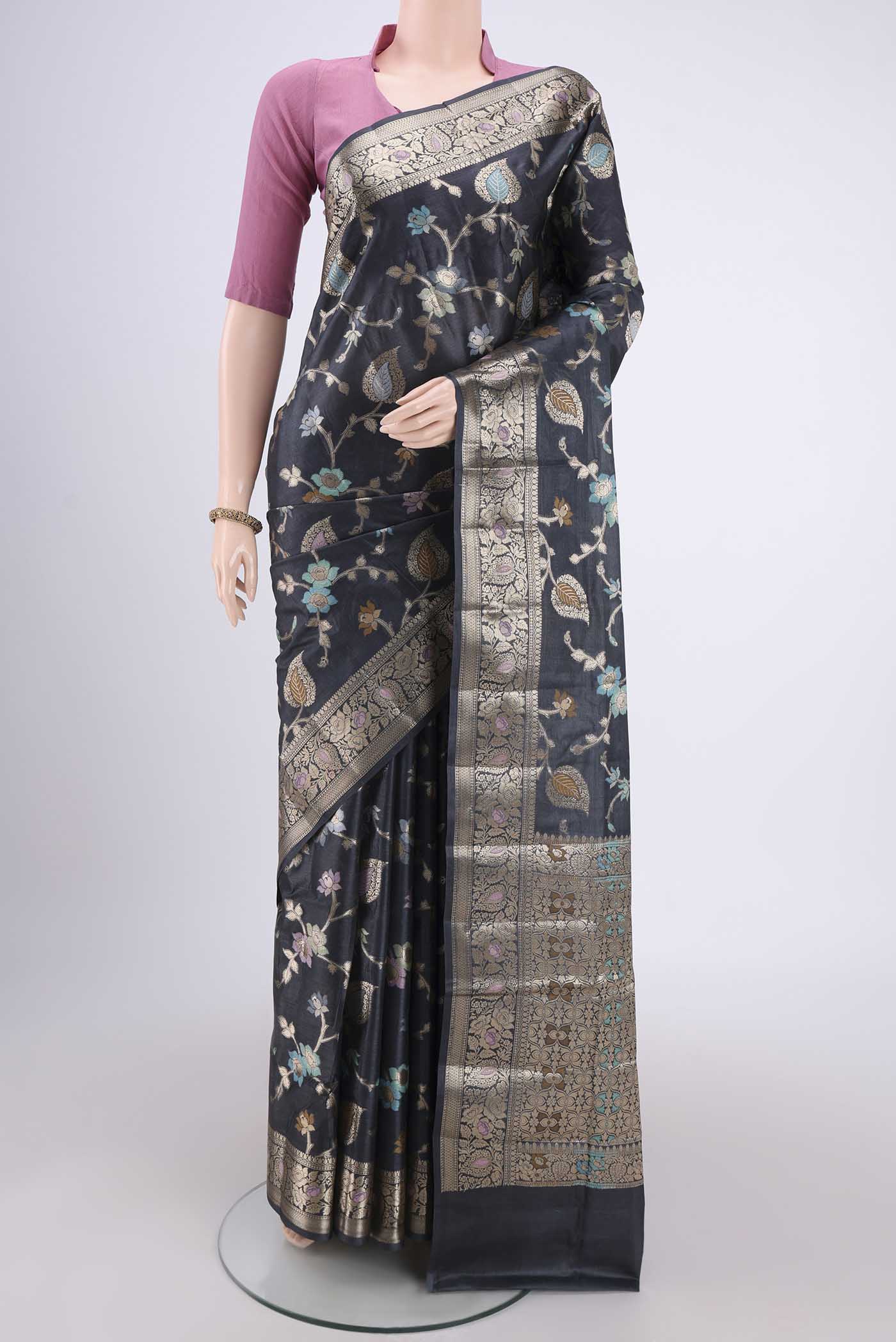 Davys Grey Banarasi Tussar Silk Saree with Zari Brocade on the body and Zari And Thread Border.  displayed on a mannequin