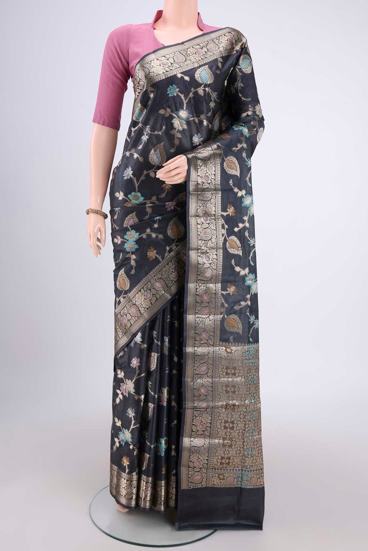 Davys Grey Banarasi Tussar Silk Saree with Zari Brocade on the body and Zari And Thread Border.  displayed on a mannequin