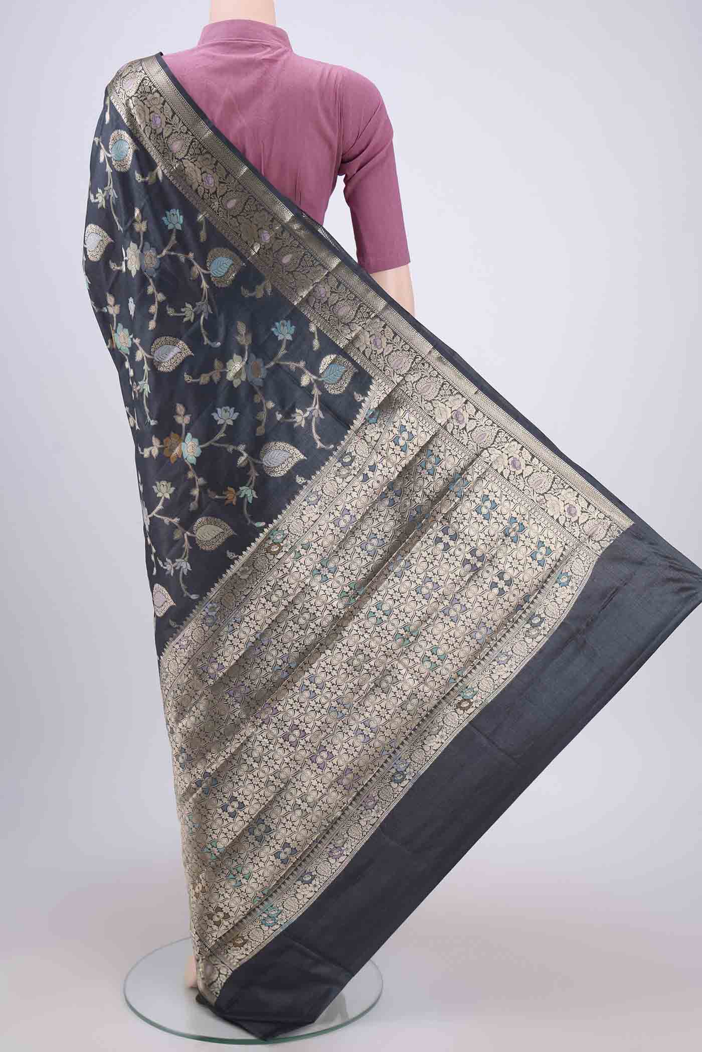Flat view of Davys Grey Banarasi Tussar Silk Saree with Zari Brocade on the body and Zari And Thread Border. 