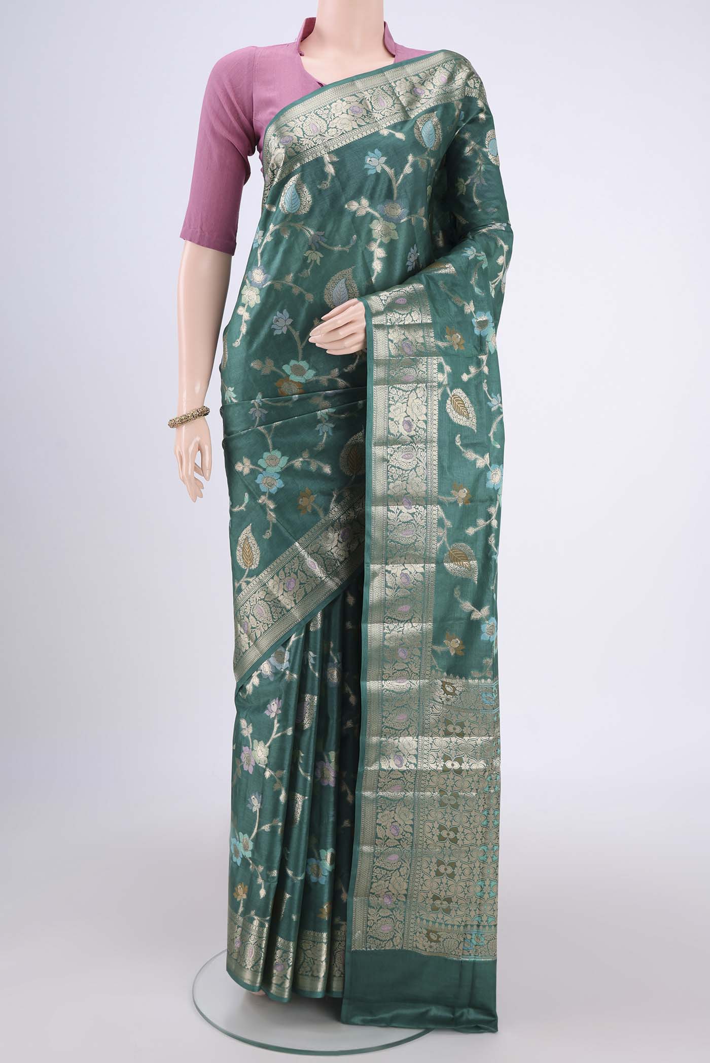 Sea Green Banarasi Tussar Silk Saree with Zari Brocade on the body and Zari And Thread Border.  displayed on a mannequin