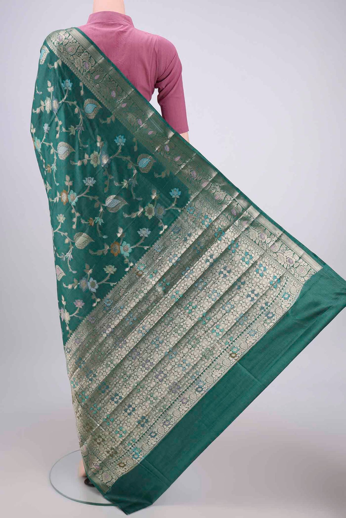 Flat view of Sea Green Banarasi Tussar Silk Saree with Zari Brocade on the body and Zari And Thread Border. 