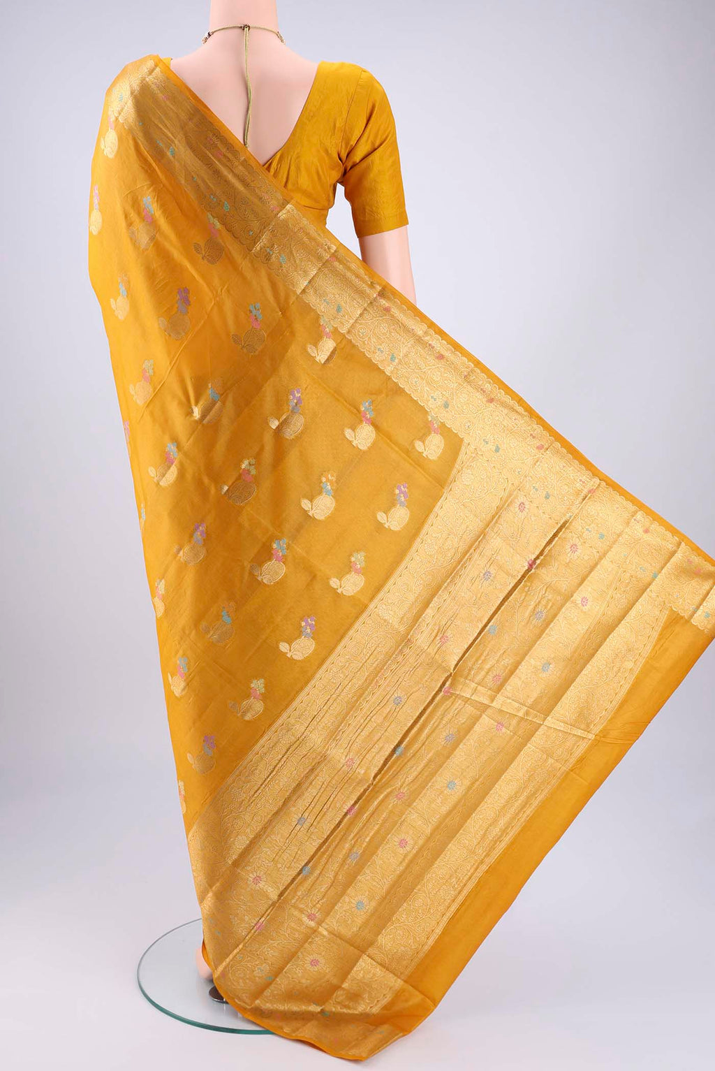 Flat view of Mustard Banarasi Tussar Silk Saree with Zari And Thread Butta on the body and Zari And Thread Border. 