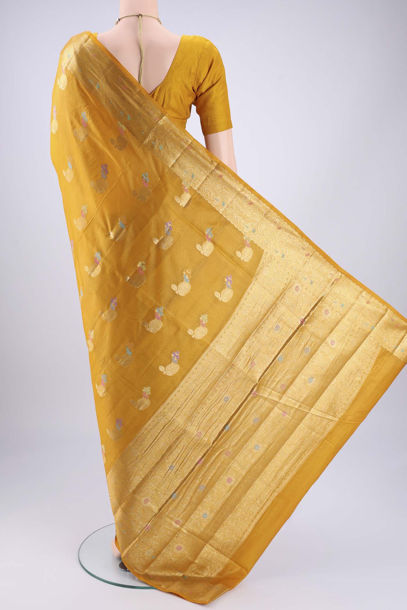 Flat view of Mustard Banarasi Tussar Silk Saree with Zari And Thread Butta on the body and Zari And Thread Border. 