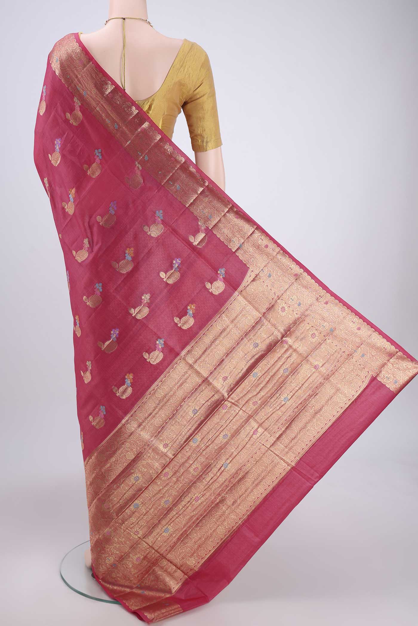 Flat view of Pink Banarasi Raw Silk Saree with Zari And Thread Butta on the body and Zari And Thread Border. 