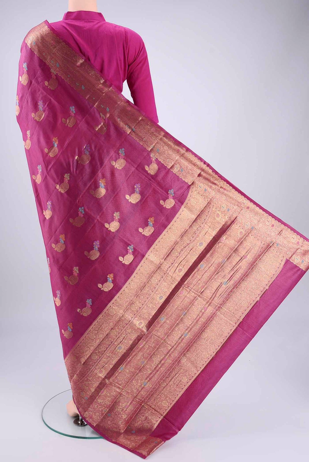 Flat view of Magenta Banarasi Tussar Silk Saree with Zari And Thread Butta on the body and Zari And Thread Border. 