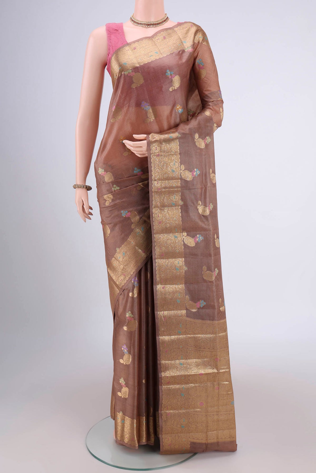 Brown Banarasi Tussar Silk Saree with Zari Brocade on the body and Zari Border.  displayed on a mannequin