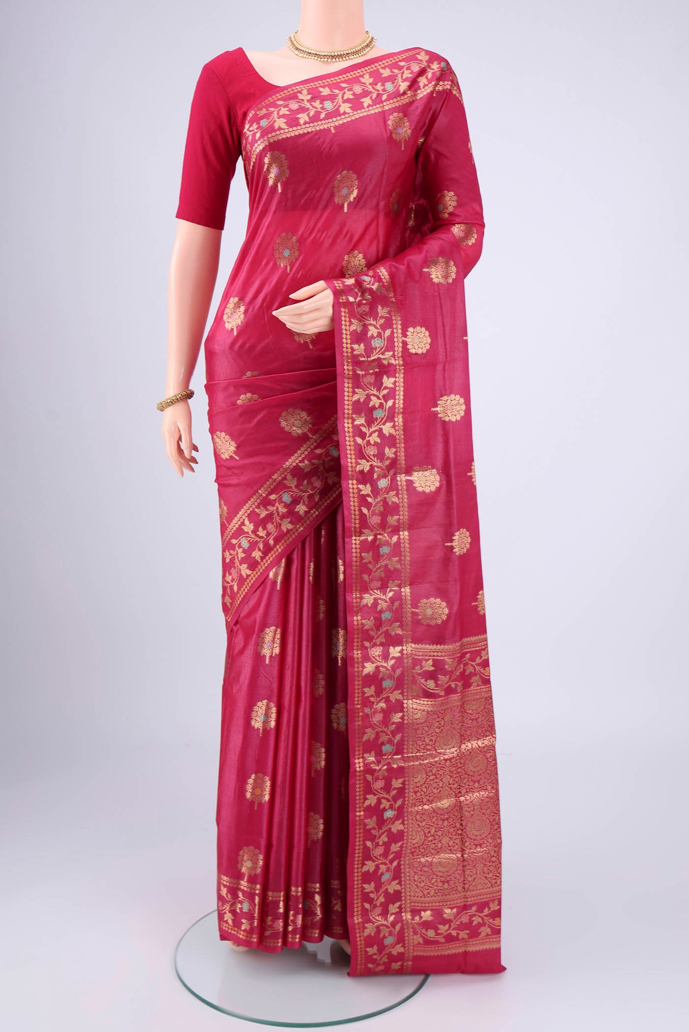 Rani Pink Banarasi Tussar Silk Saree with Zari And Thread Butta on the body and Zari And Thread Border.  displayed on a mannequin