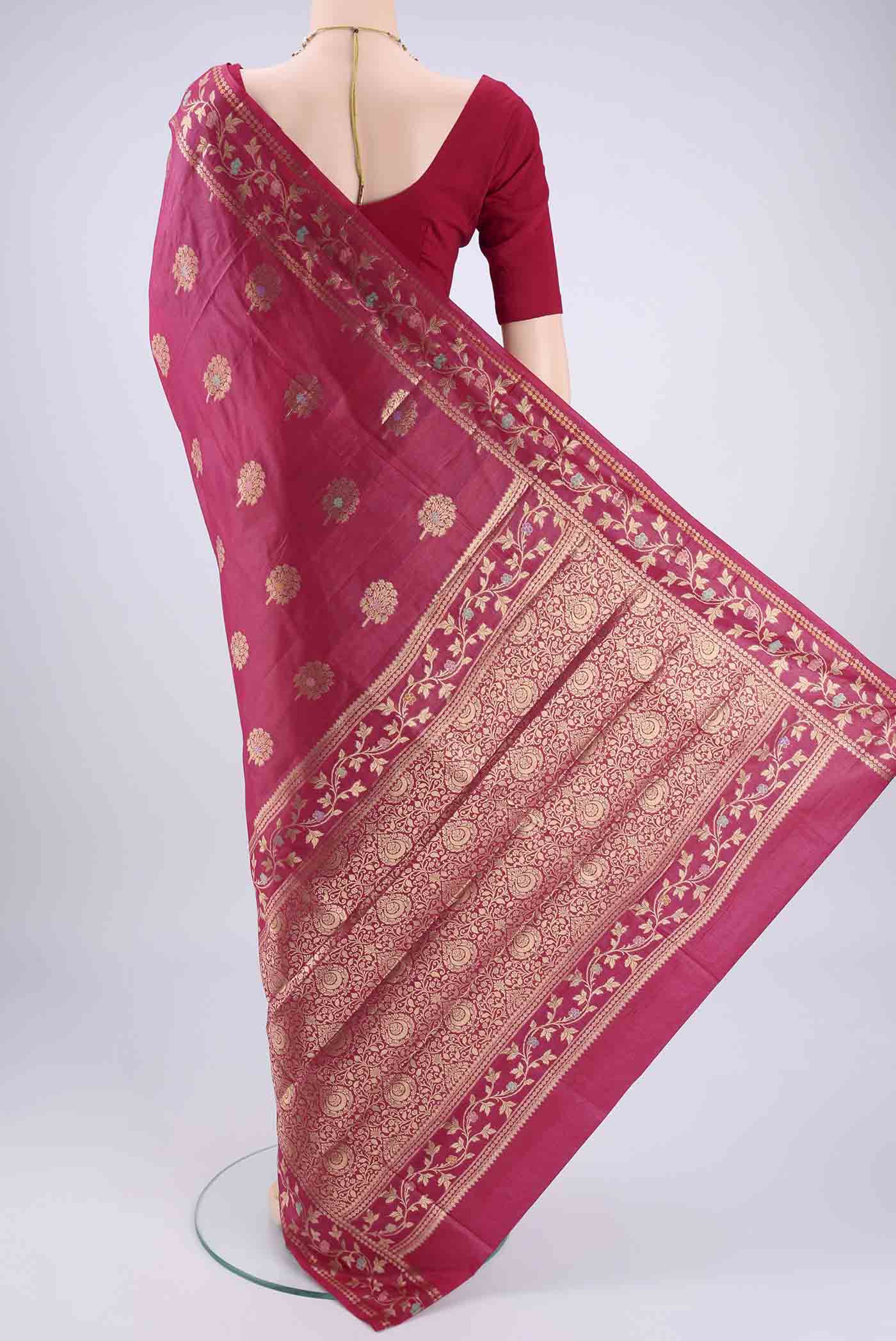 Flat view of Rani Pink Banarasi Tussar Silk Saree with Zari And Thread Butta on the body and Zari And Thread Border. 