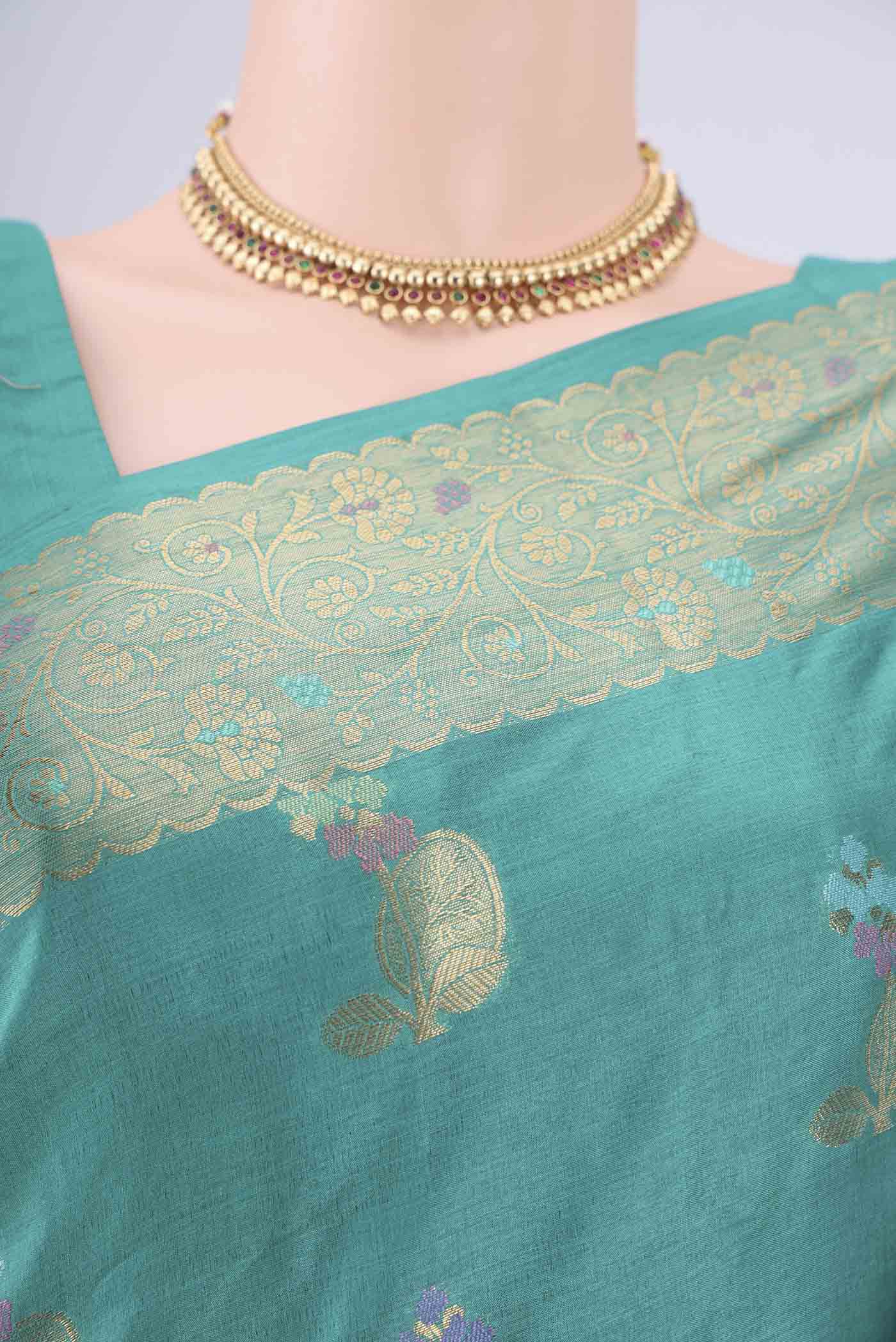 Border image of Turquoise Banarasi Tussar Silk Saree with Zari And Thread Butta on the body and Zari And Thread Border. 