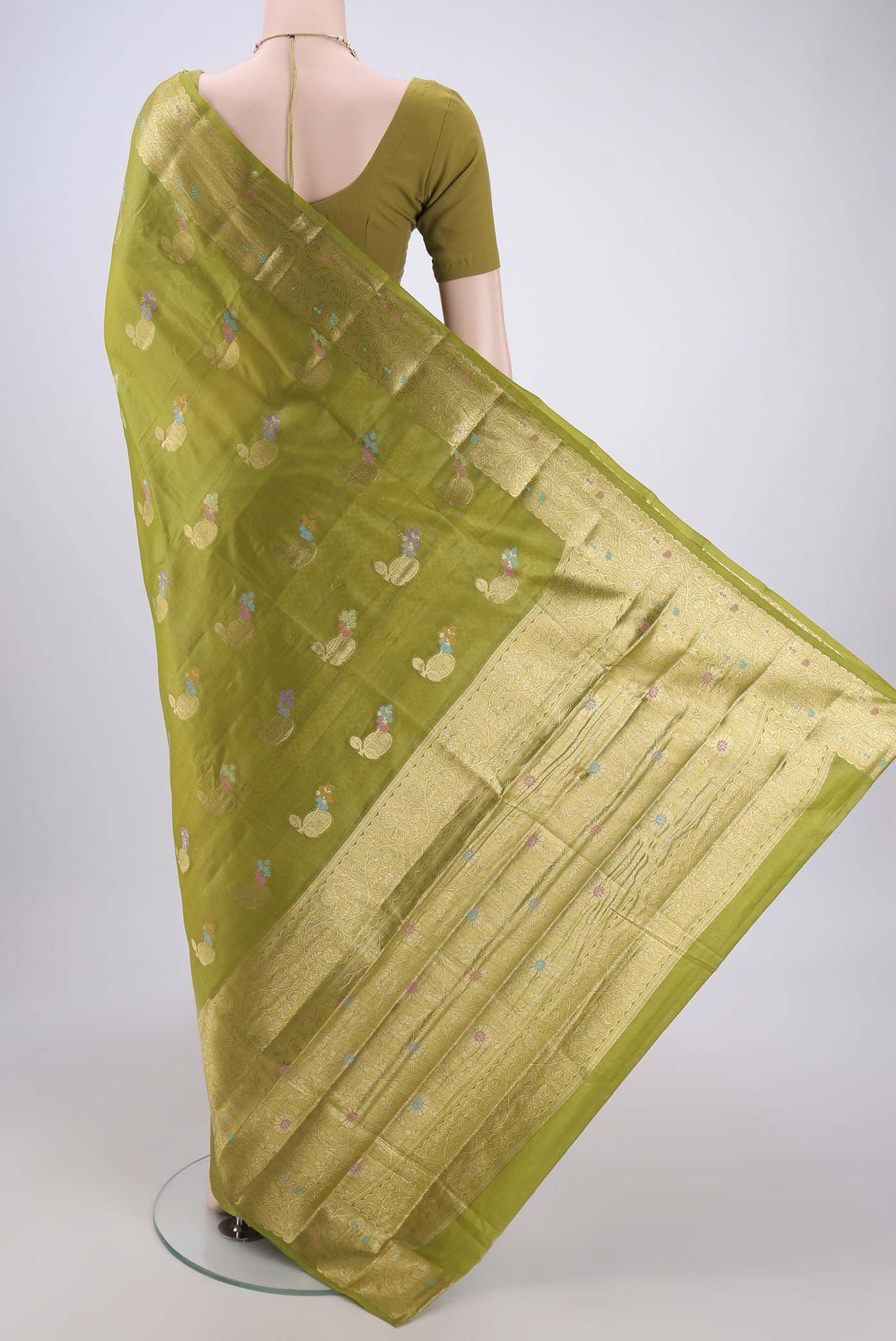Flat view of Light Green Banarasi Tussar Silk Saree with Zari And Thread Butta on the body and Zari And Thread Border. 