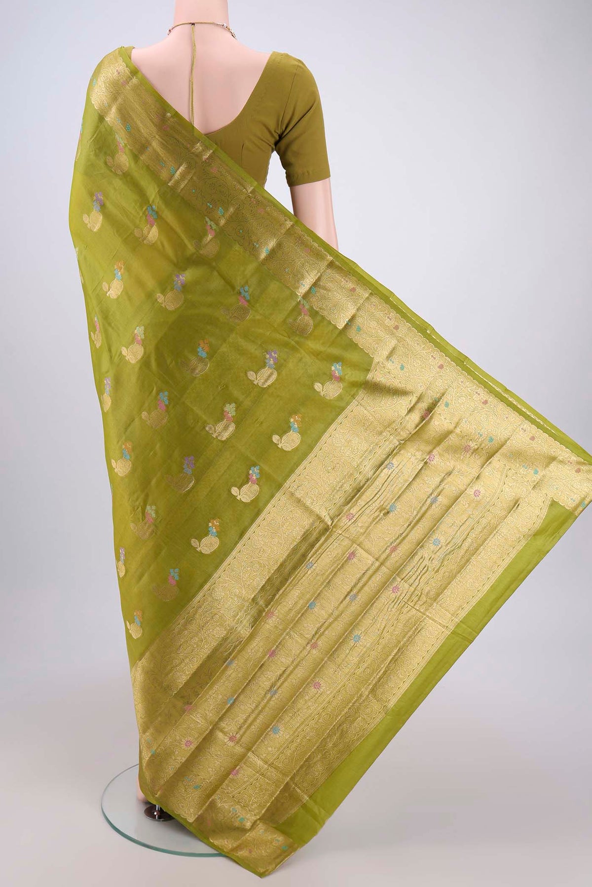 Flat view of Light Green Banarasi Tussar Silk Saree with Zari And Thread Butta on the body and Zari And Thread Border. 