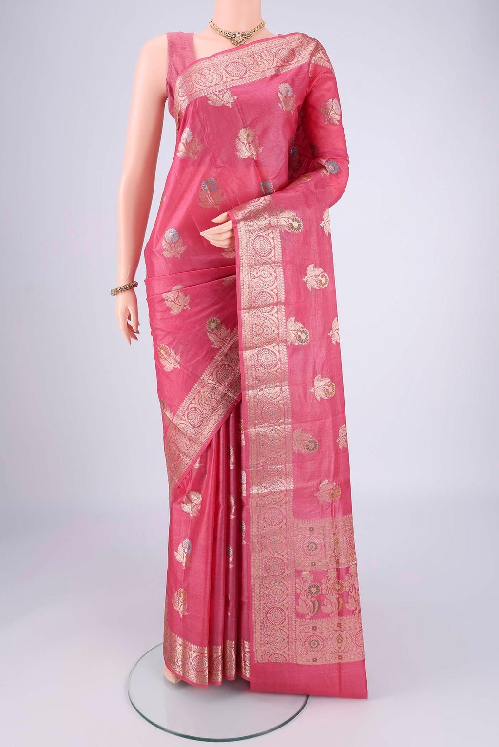 Pink Banarasi Tussar Silk Saree with Zari And Thread Butta on the body and Zari And Thread Border.  displayed on a mannequin