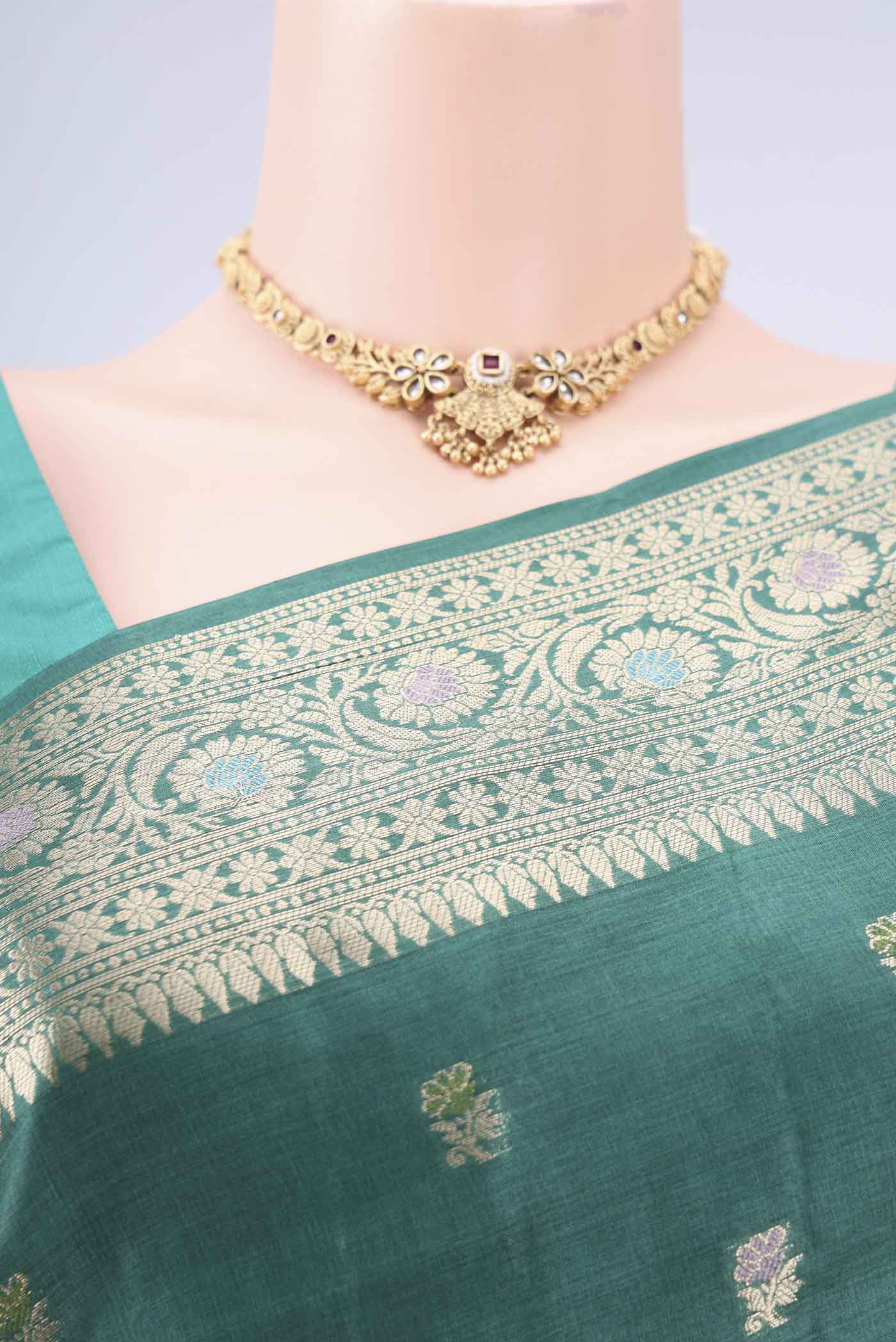Border image of Green Banarasi Tussar Silk Saree with Zari Butta on the body and Zari And Thread Border. 