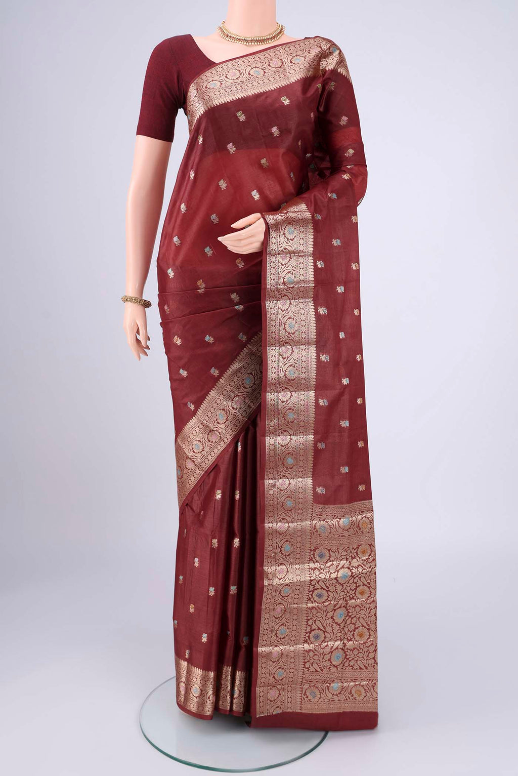 Brown Banarasi Tussar Silk Saree with Zari And Thread Butta on the body and Zari And Thread Border.  displayed on a mannequin