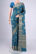 Blue Banarasi Tussar Silk Saree with Zari And Thread Butta on the body and Zari And Thread Border.  displayed on a mannequin