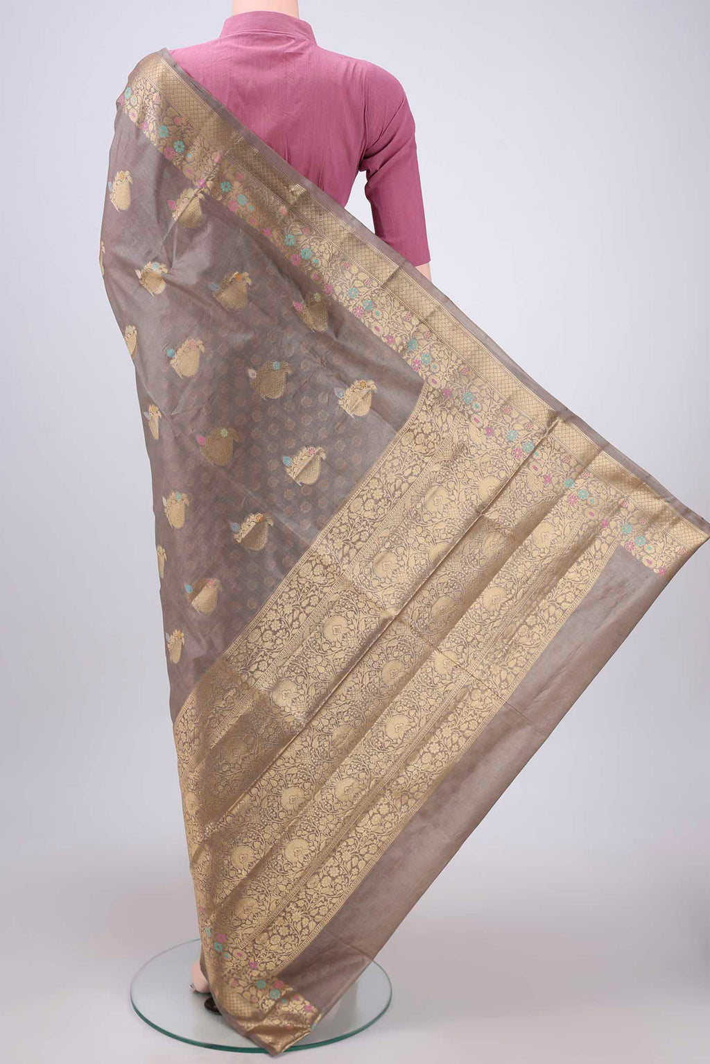 Flat view of Beige Banarasi Tussar Silk Saree with Zari And Thread Butta on the body and Zari And Thread Border. 