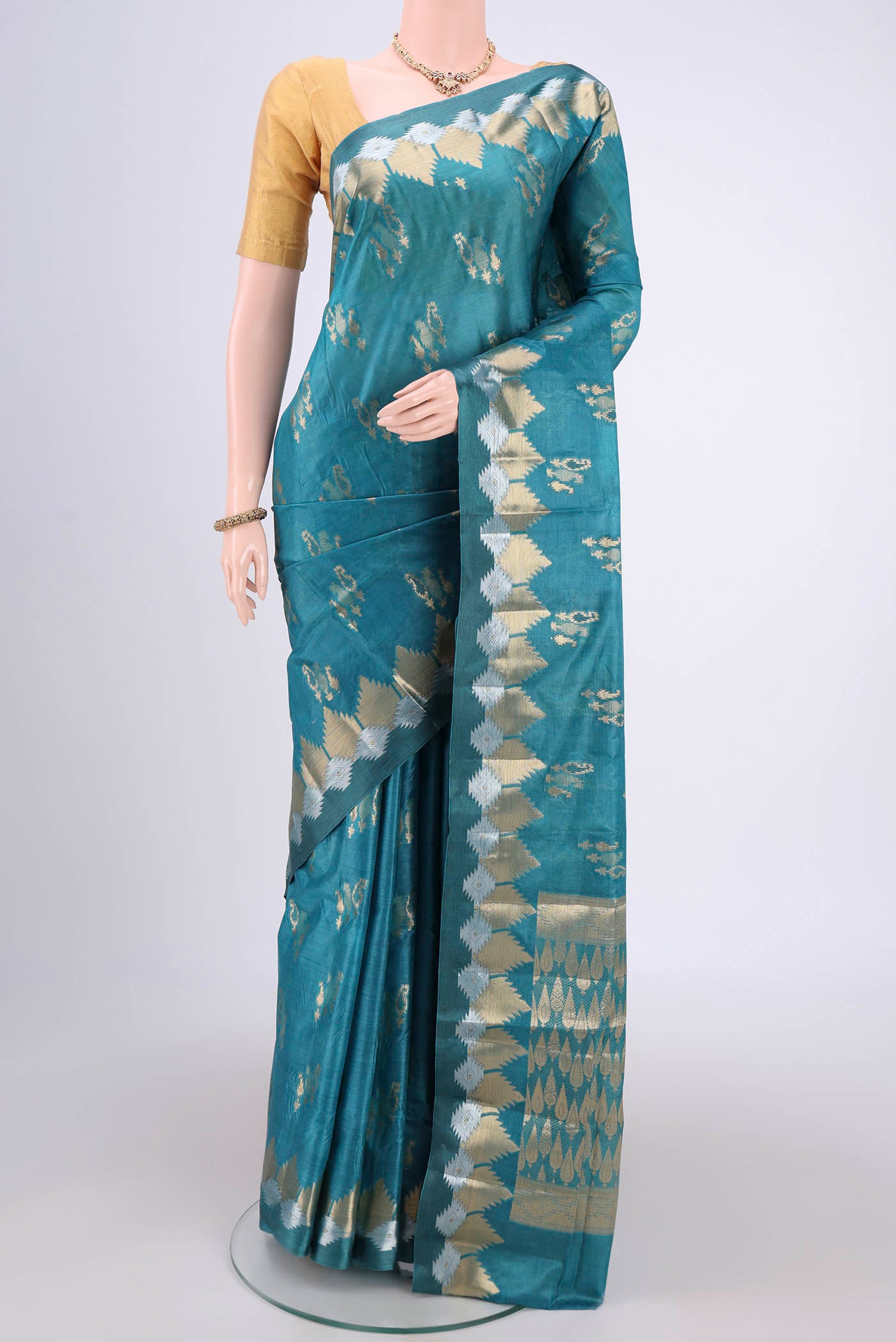 Blue Banarasi Tussar Silk Saree with Zari Butta on the body and Zari Border.  displayed on a mannequin