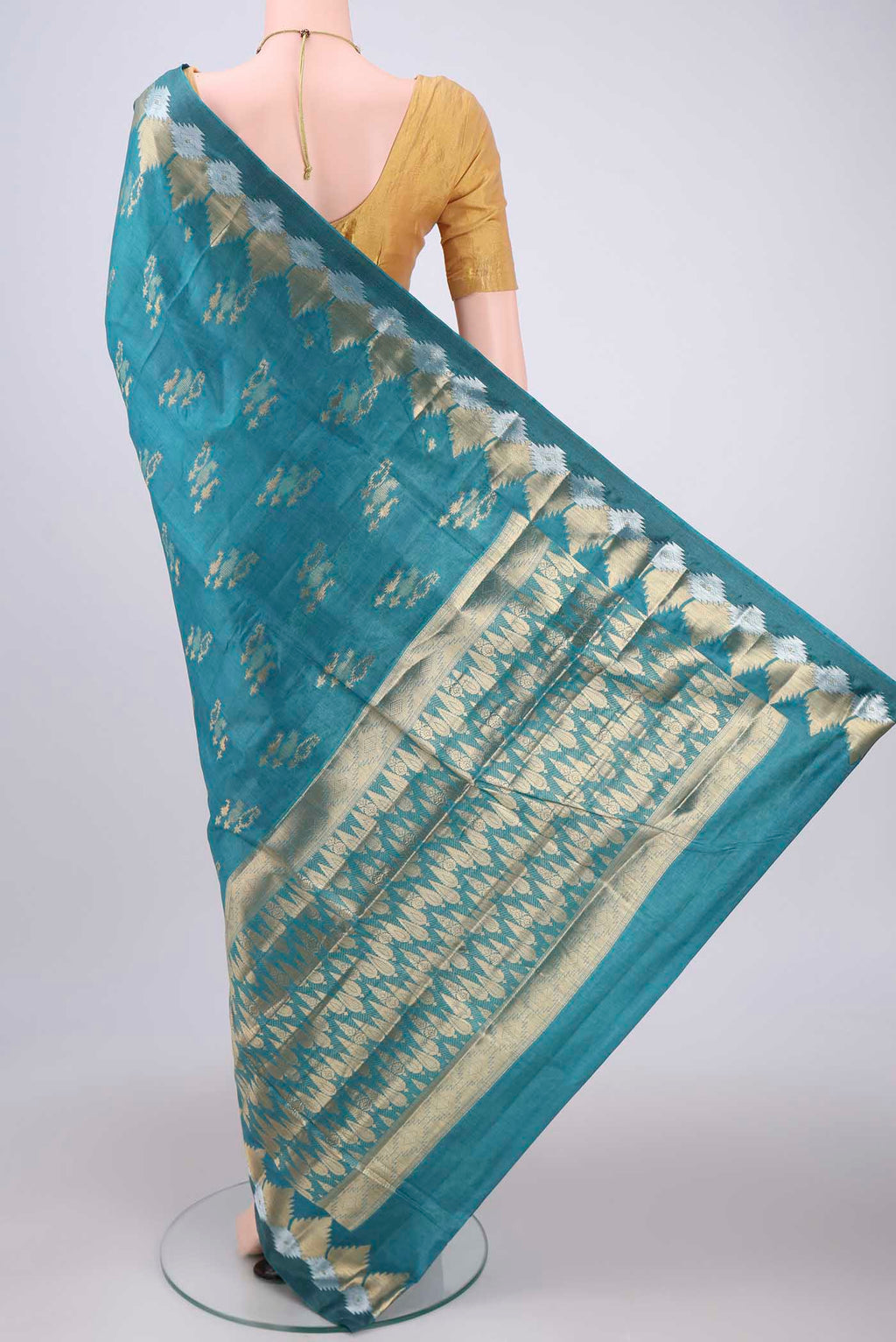 Flat view of Blue Banarasi Tussar Silk Saree with Zari Butta on the body and Zari Border. 