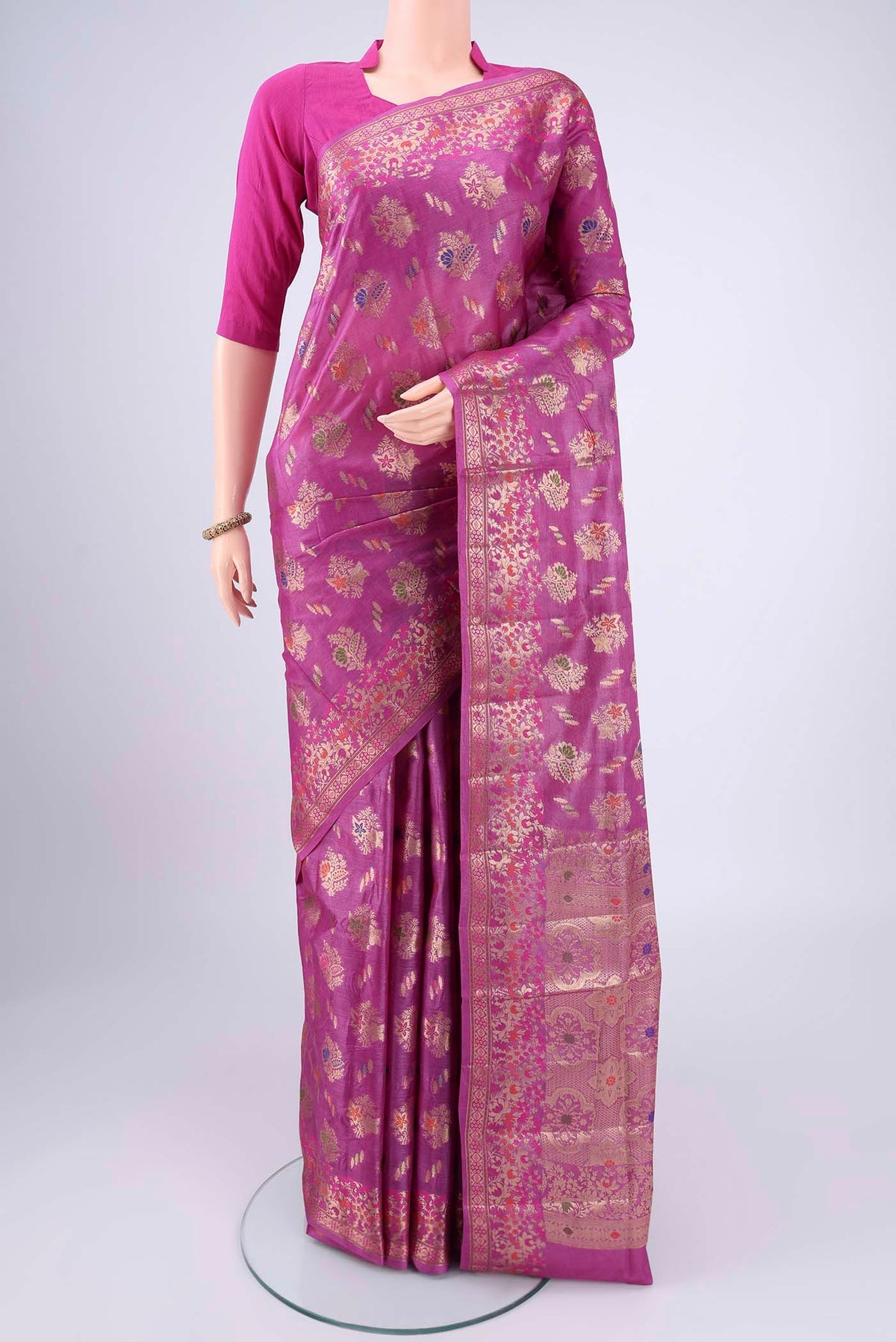 Magenta Banarasi Tussar Silk Saree with Zari Brocade on the body and Zari And Thread Border.  displayed on a mannequin