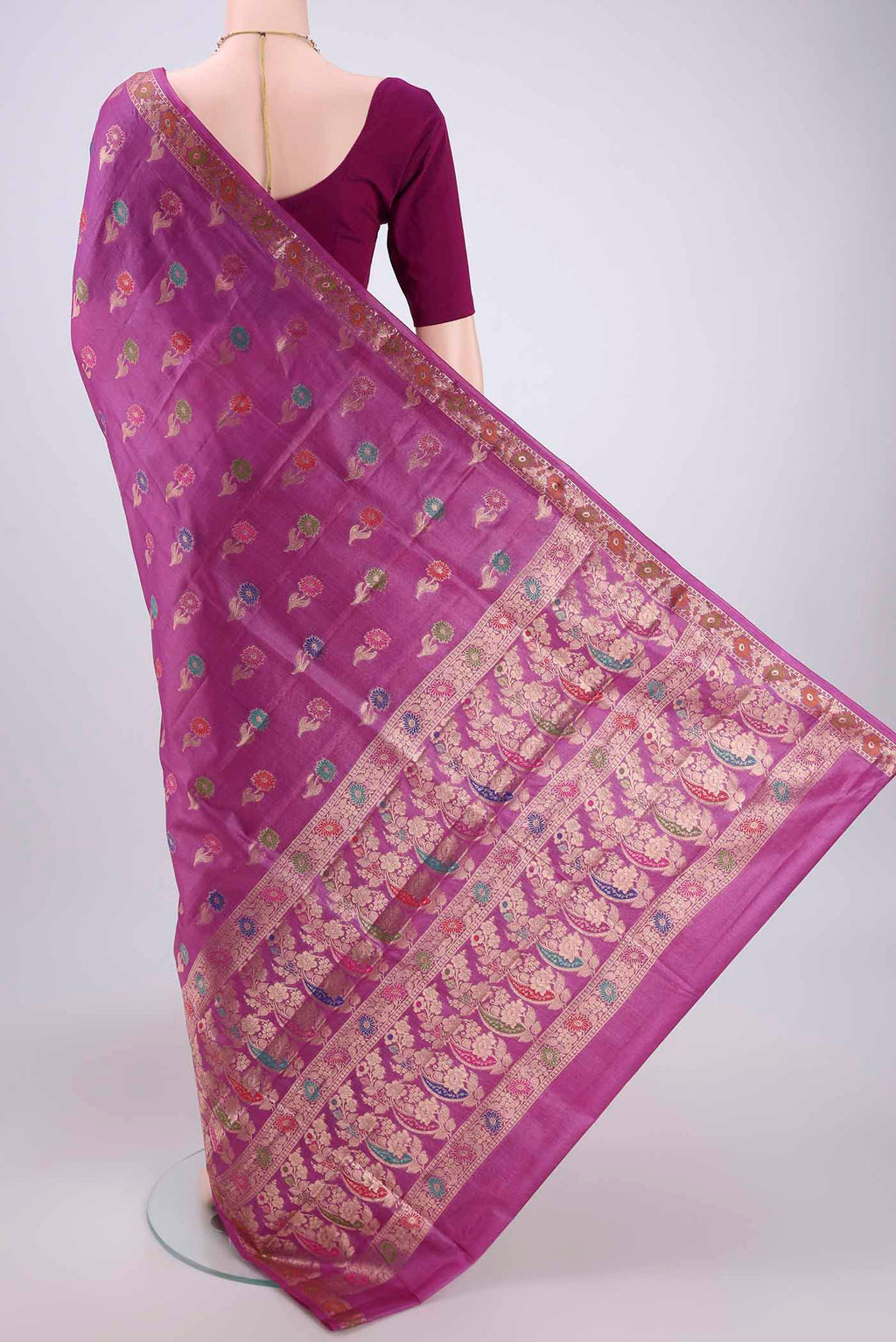 Flat view of Light Magenta Banarasi Raw Silk Saree with Zari And Thread Butta on the body and Zari And Thread Border. 