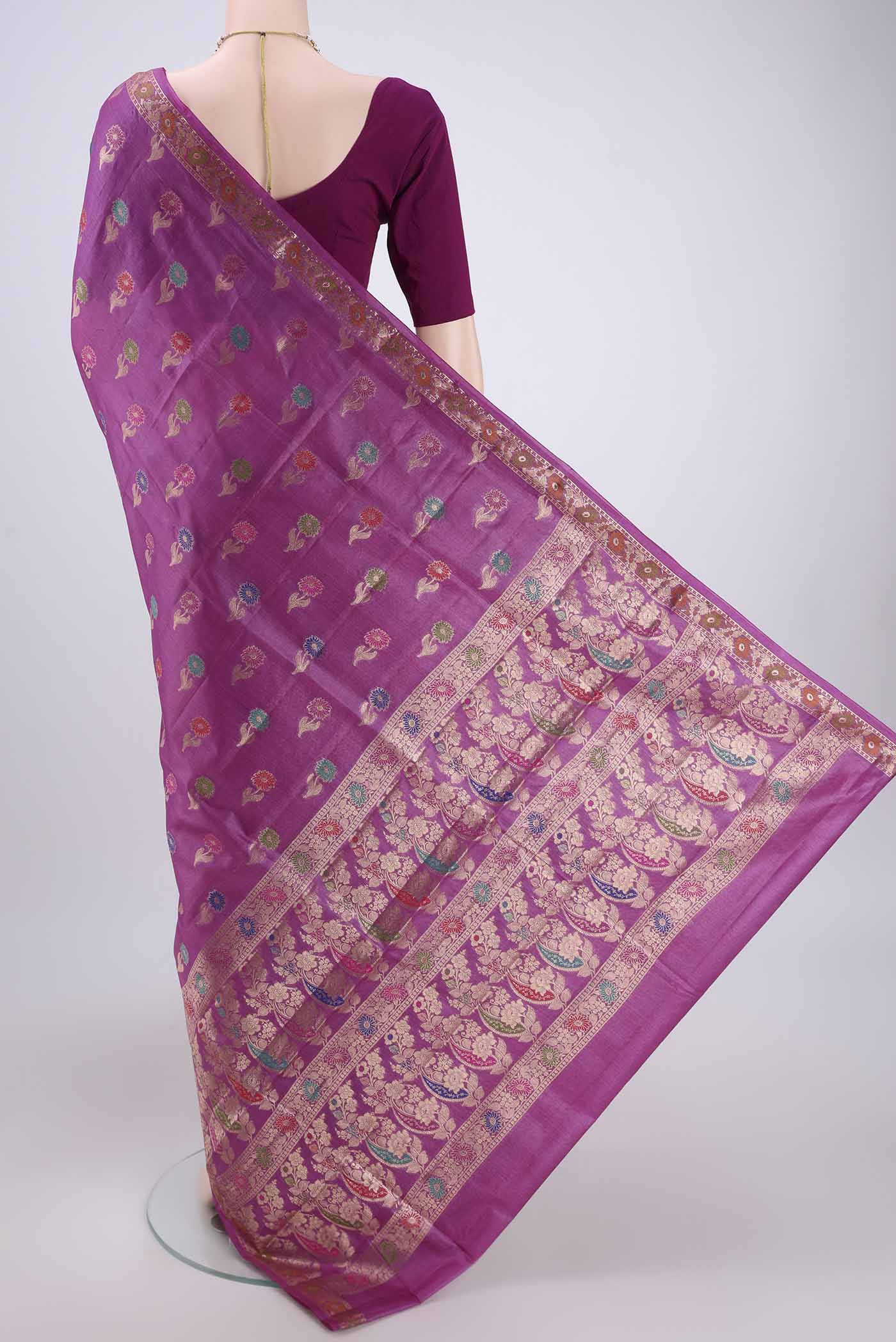 Flat view of Light Magenta Banarasi Raw Silk Saree with Zari And Thread Butta on the body and Zari And Thread Border. 