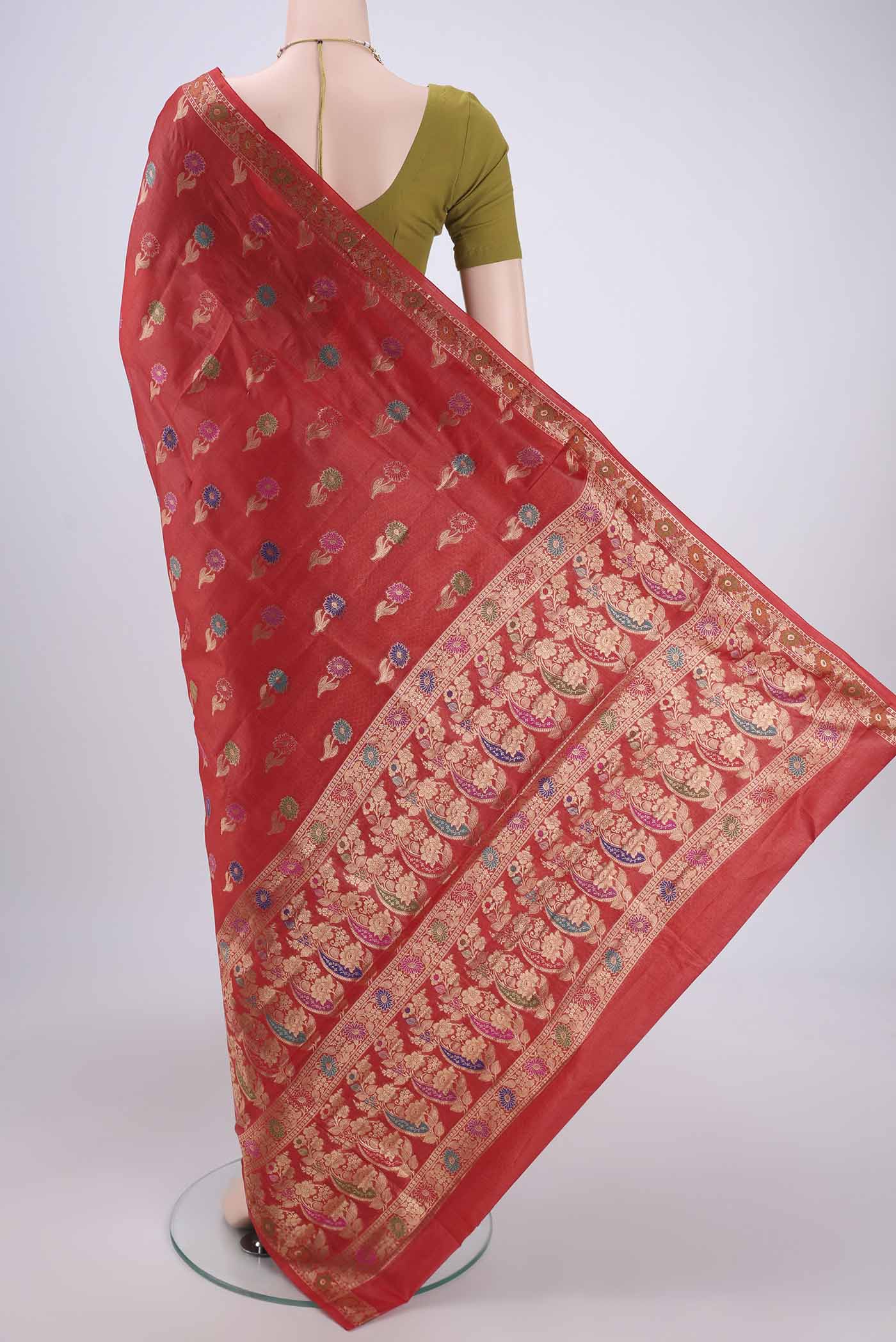 Flat view of Red Banarasi Tussar Silk Saree with Zari And Thread Butta on the body and Zari And Thread Border. 