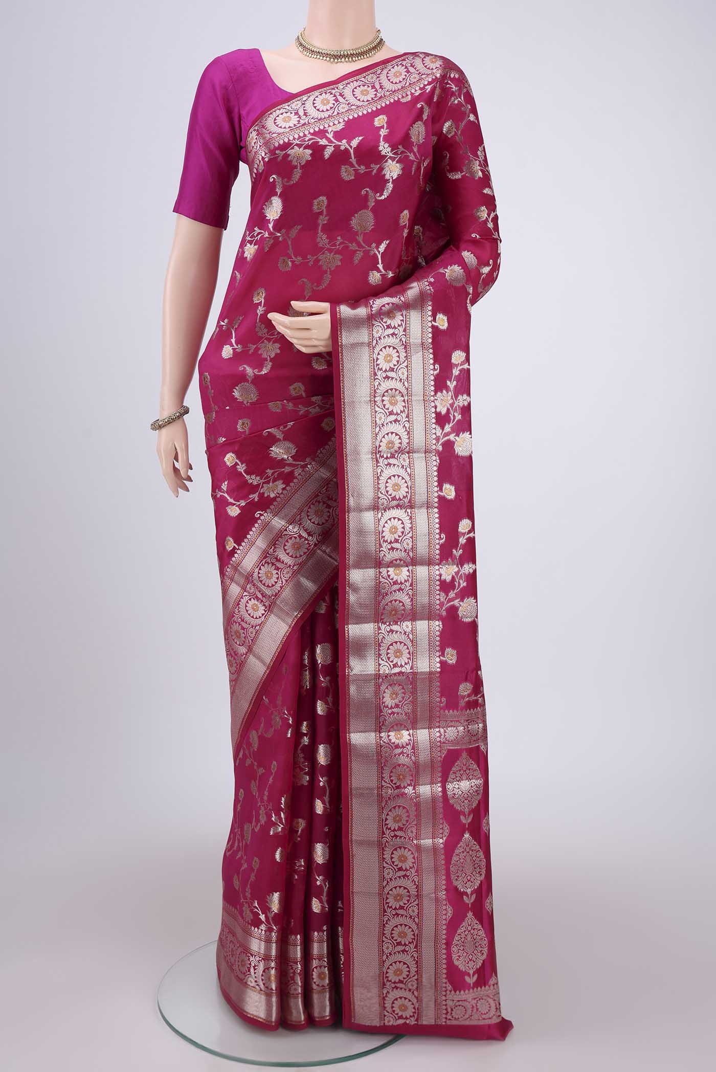Rani Pink Banarasi Raw Silk Saree with Zari Brocade on the body and Zari Border.  displayed on a mannequin