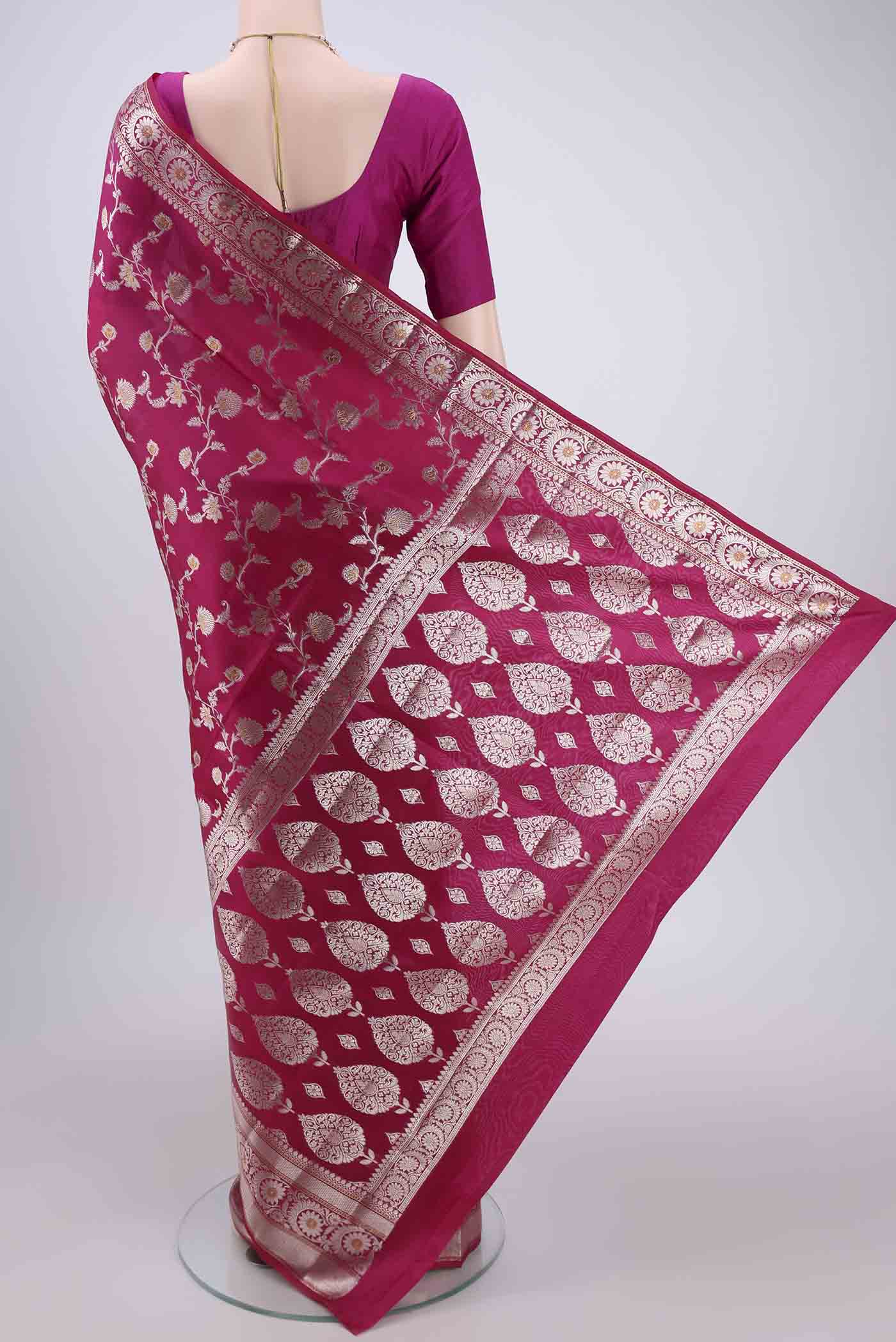 Flat view of Rani Pink Banarasi Raw Silk Saree with Zari Brocade on the body and Zari Border. 