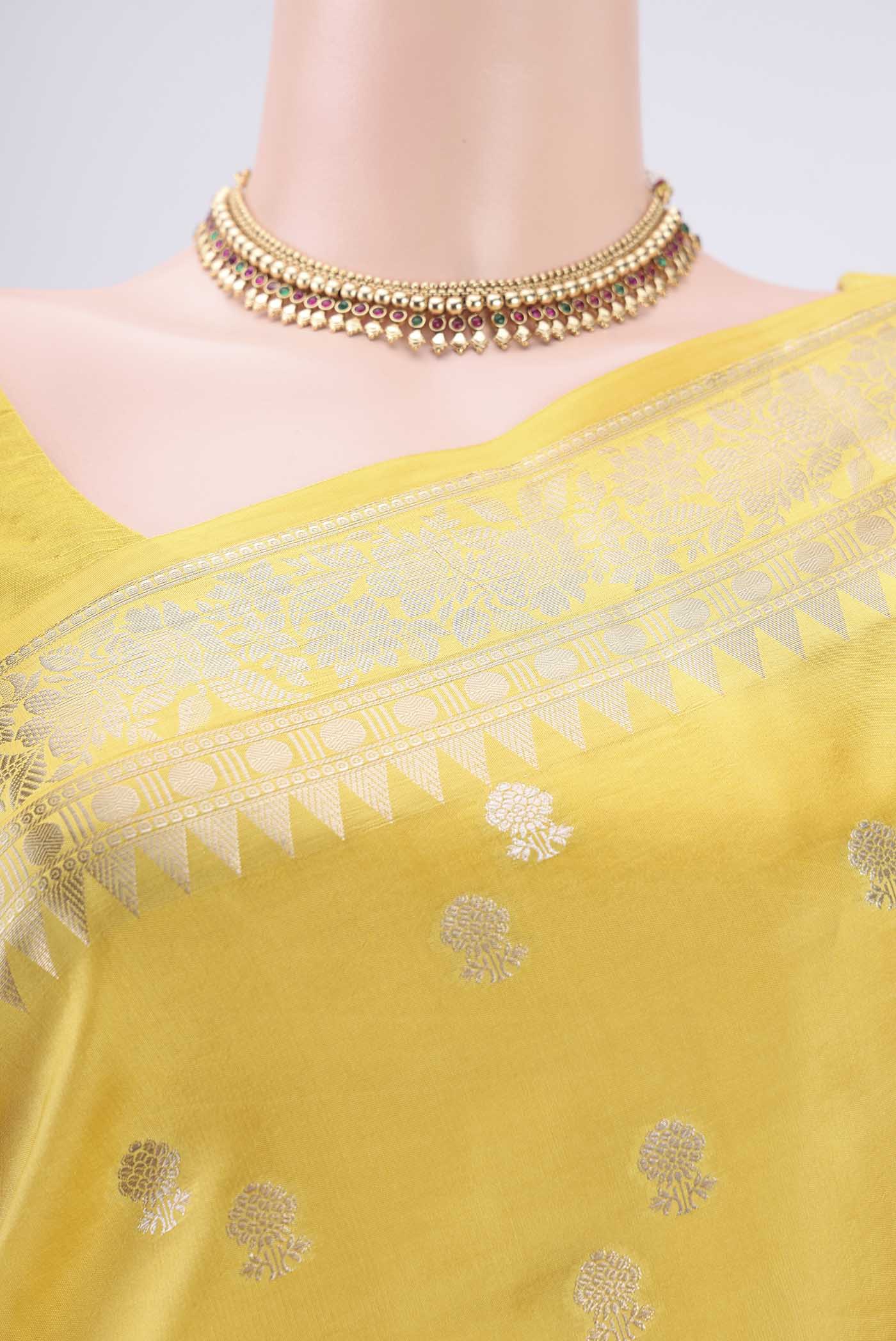 Border image of Lemon Yellow Banarasi Raw Silk Saree with Zari Butta on the body and Zari Border. 