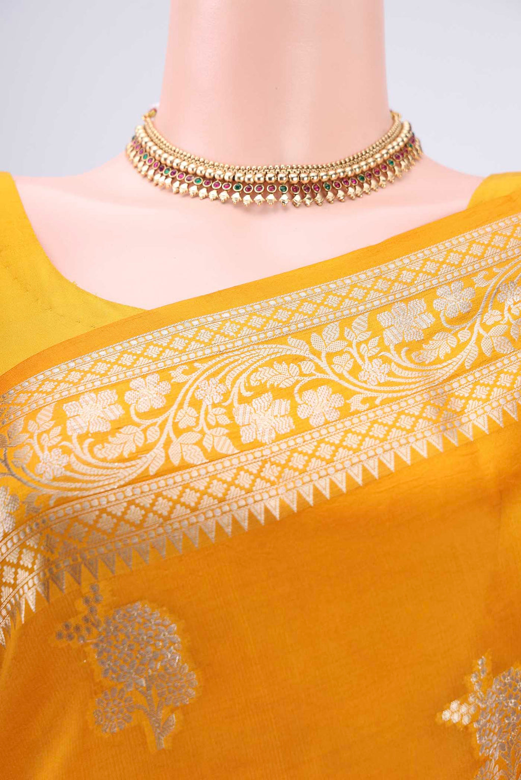 Border image of Yellow Banarasi Raw Silk Saree with Zari Butta on the body and Zari Border. 