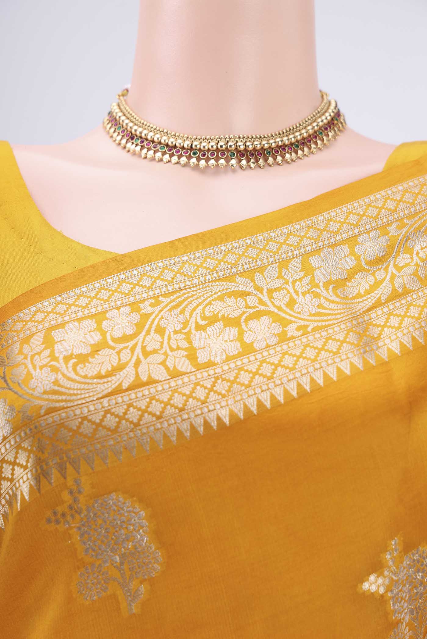 Border image of Yellow Banarasi Raw Silk Saree with Zari Butta on the body and Zari Border. 