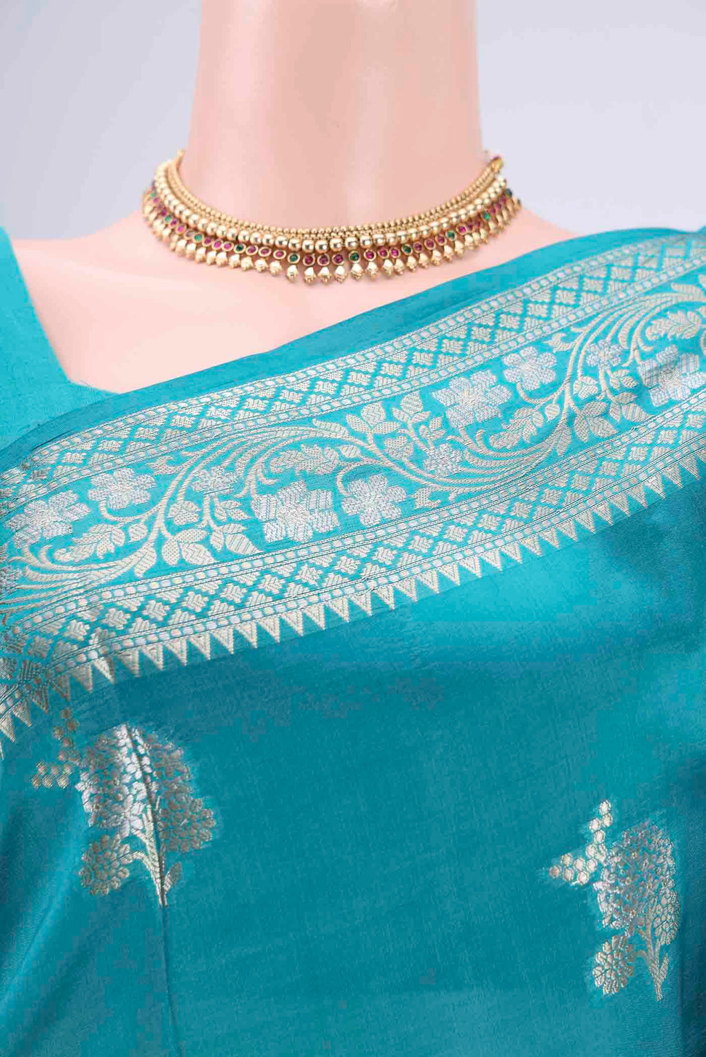 Border image of Teal Banarasi Raw Silk Saree with Zari Butta on the body and Zari Border. 