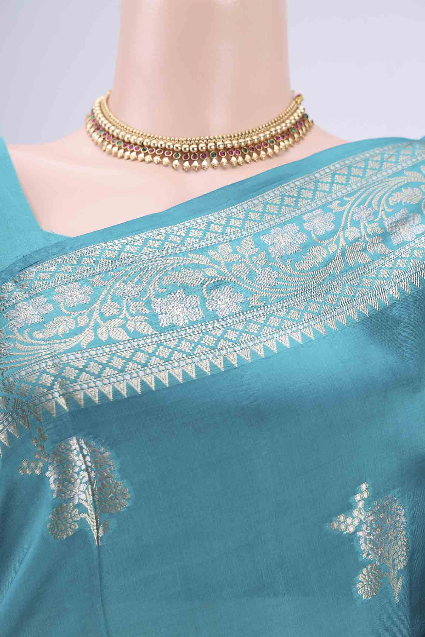 Border image of Teal Banarasi Raw Silk Saree with Zari Butta on the body and Zari Border. 