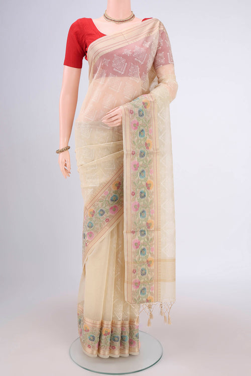 Beige Blended Kota Cotton Saree with Embroidery on the body and Thread Border.  displayed on a mannequin