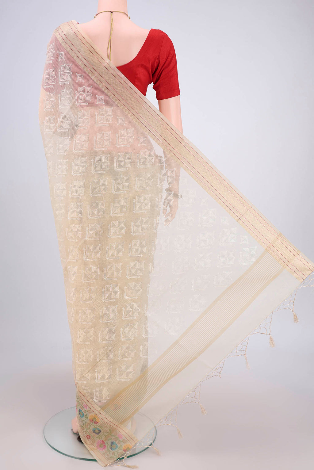 Flat view of Beige Blended Kota Cotton Saree with Embroidery on the body and Thread Border. 