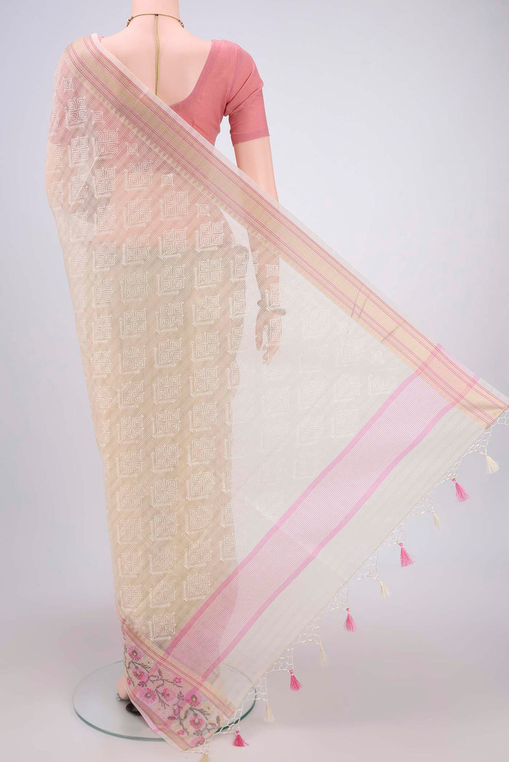 Flat view of Cream Blended Kota Cotton Saree with Embroidery on the body and Thread Border. 