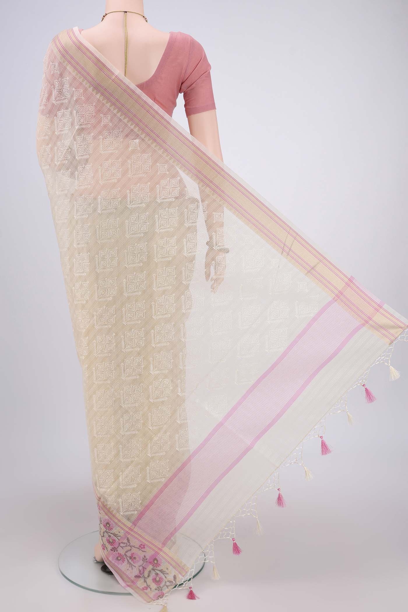 Flat view of Cream Blended Kota Cotton Saree with Embroidery on the body and Thread Border. 
