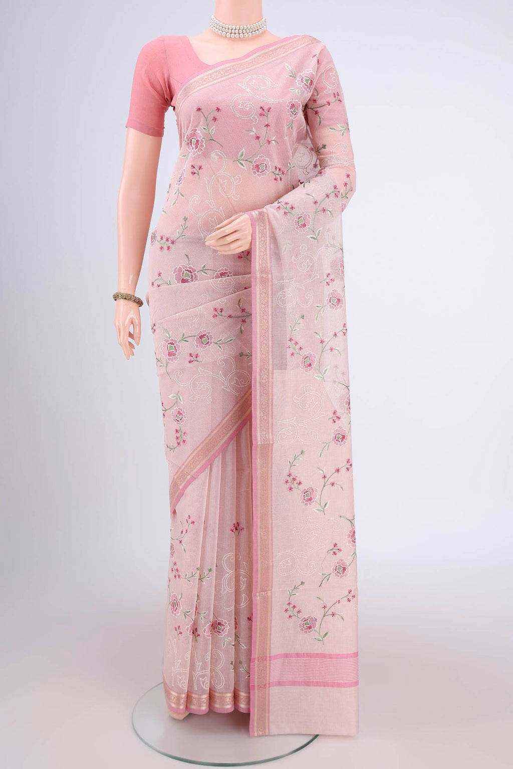 Rose pink Blended Kota Cotton Saree with Embroidery on the body and Zari Border.  displayed on a mannequin