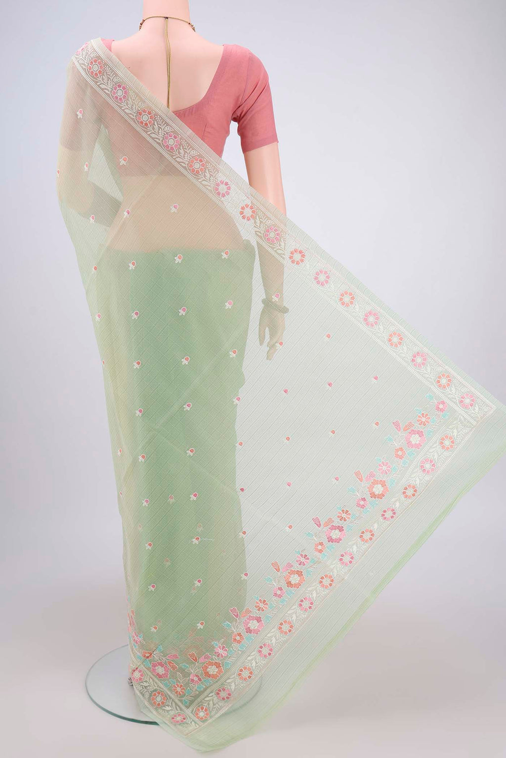 Flat view of Light Green Blended Kota Cotton Saree with Thread Butta on the body and Embroidery Border. 