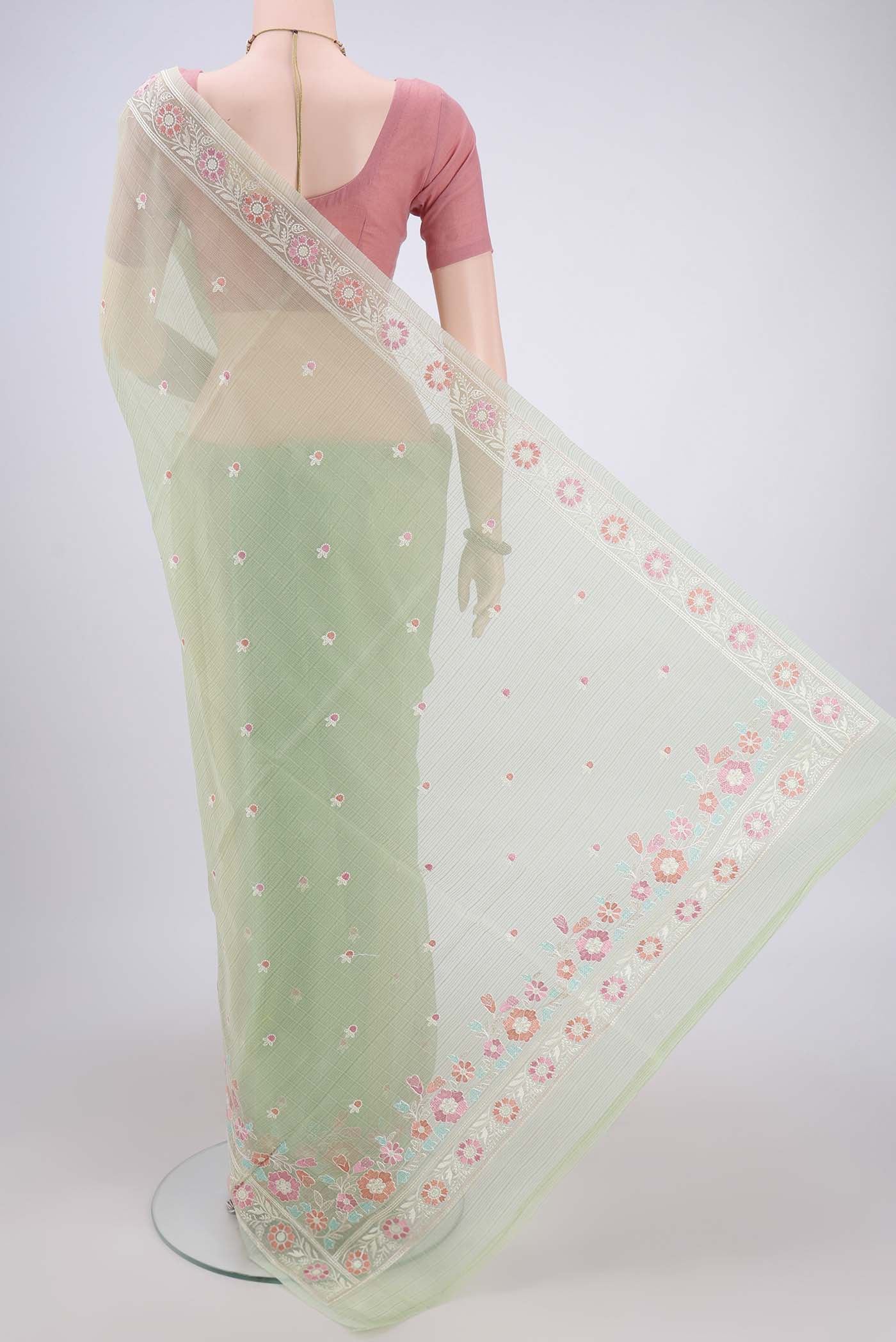 Flat view of Light Green Blended Kota Cotton Saree with Thread Butta on the body and Embroidery Border. 