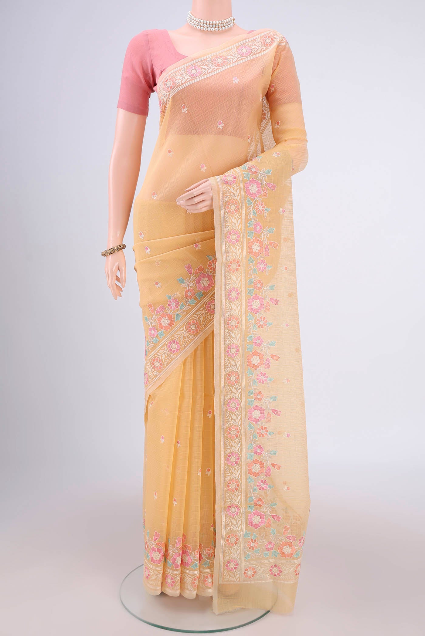 Yellow Blended Kota Cotton Saree with Embroidery on the body and Embroidery Border.  displayed on a mannequin