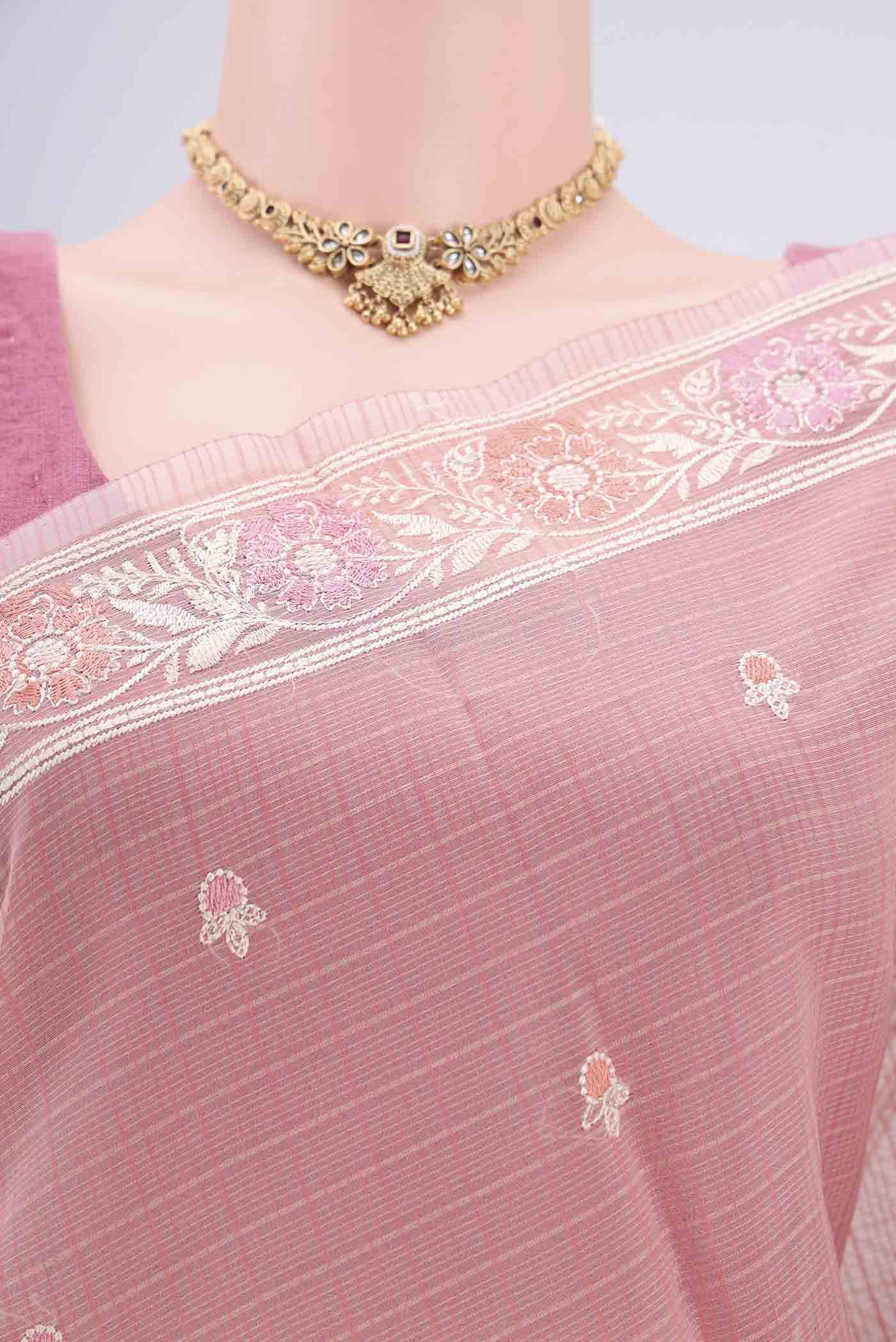 Border image of Peach Blended Kota Cotton Saree with Embroidery on the body and Embroidery Border. 