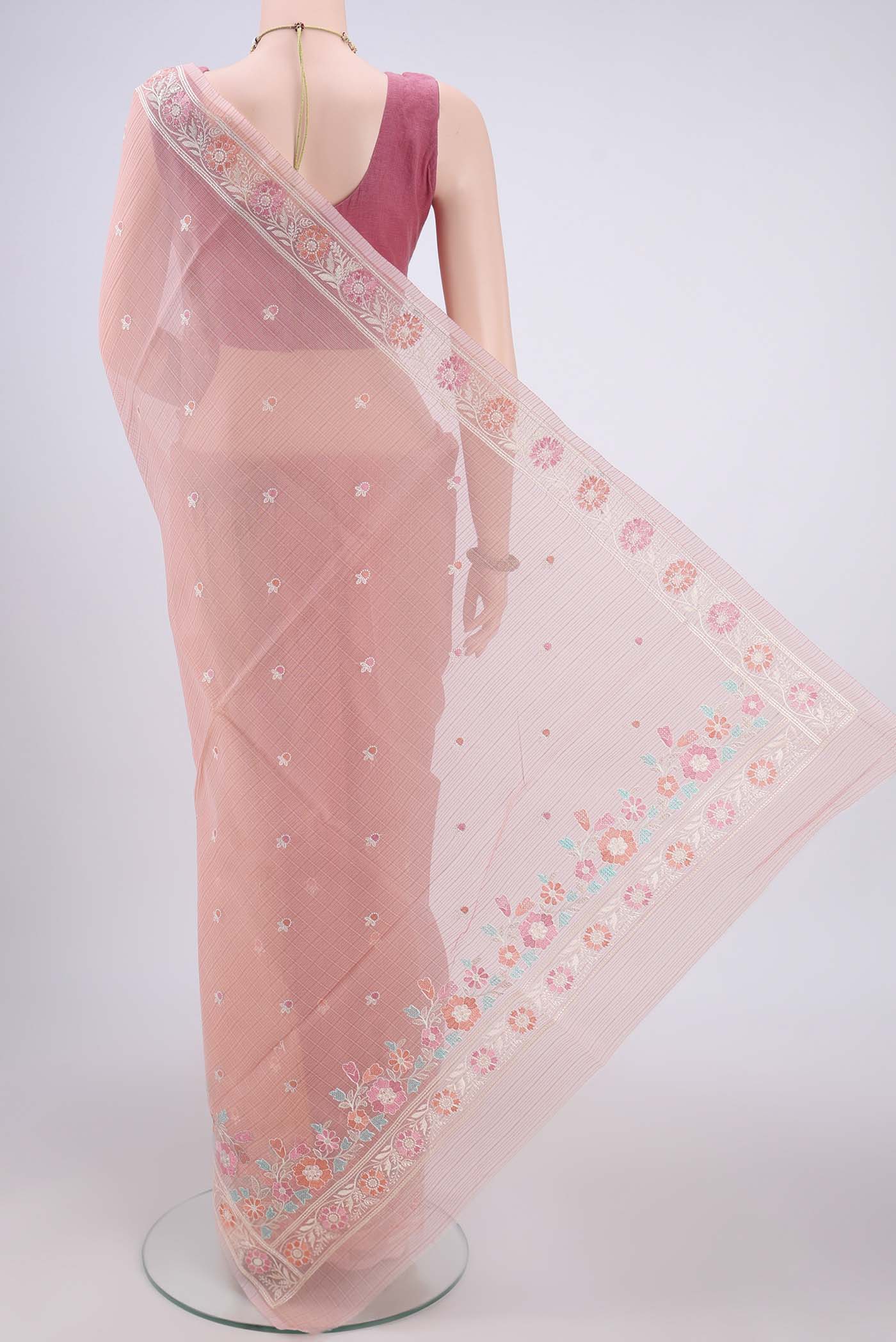 Flat view of Peach Blended Kota Cotton Saree with Embroidery on the body and Embroidery Border. 