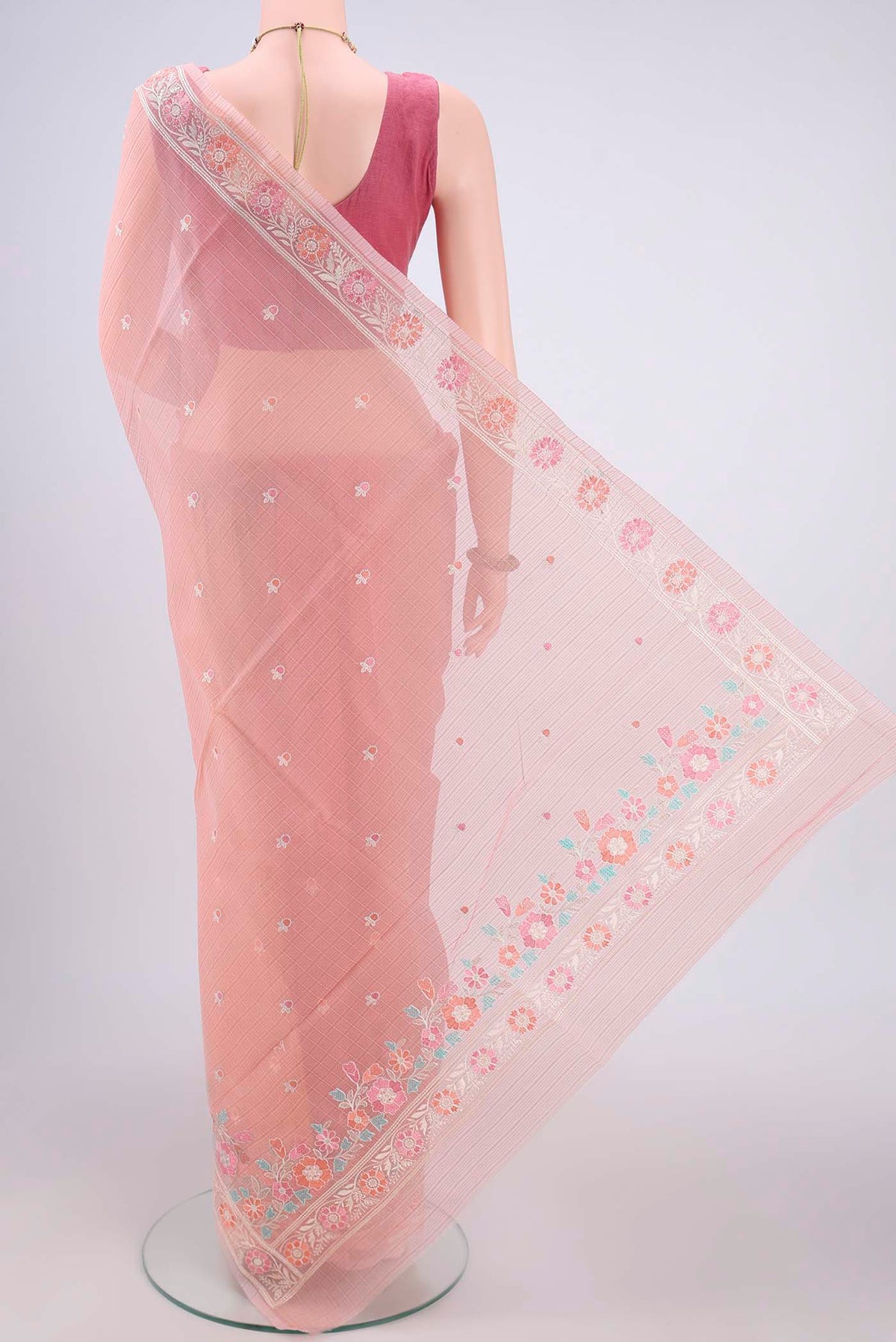 Flat view of Peach Blended Kota Cotton Saree with Embroidery on the body and Embroidery Border. 
