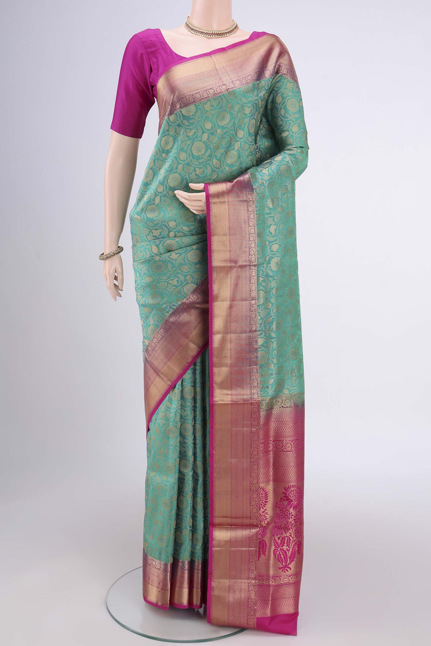 Orange with Pink Dual Tone Soft Silk Saree with Zari Brocade on the body and Zari Border.  displayed on a mannequin